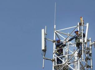 Cell towers with a worker